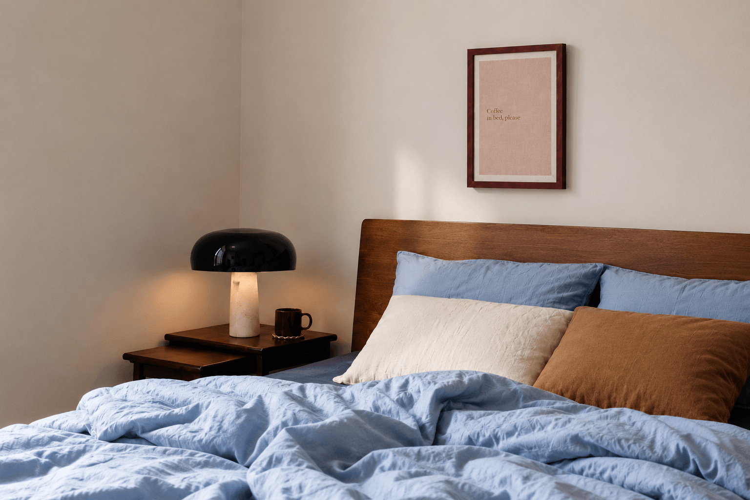 The coffee in bed linen print framed above a bed